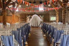 aisle-pale-blue-chair-covers-and-ceremon-backdrop