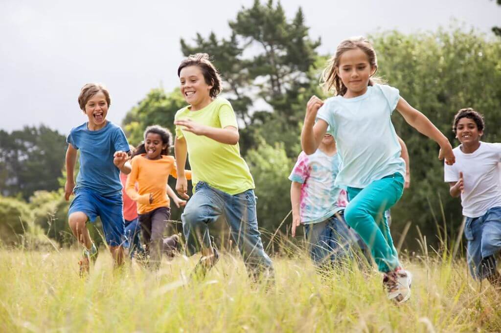 Children running in a field