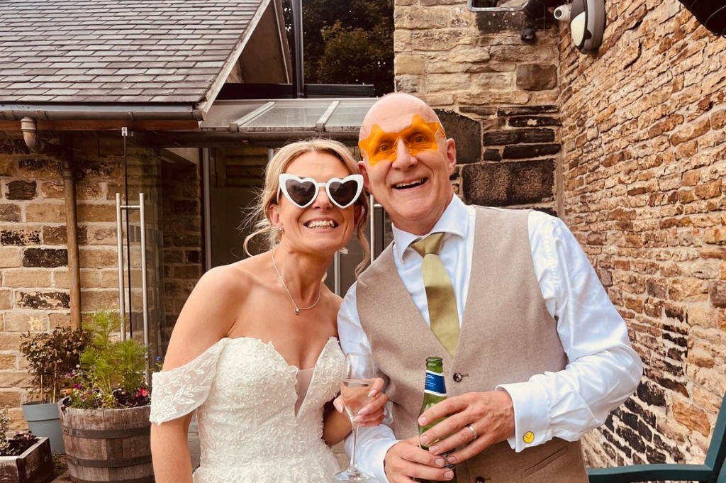 bride and groom in funky sunglasses