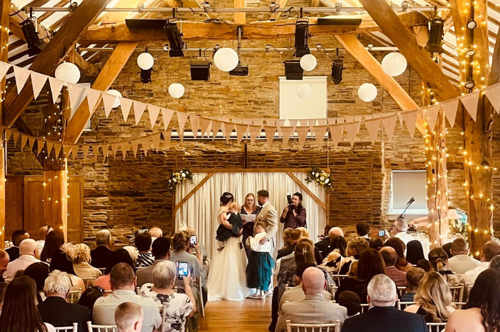 Bride and groom at the alter at The Northorpe Barn
