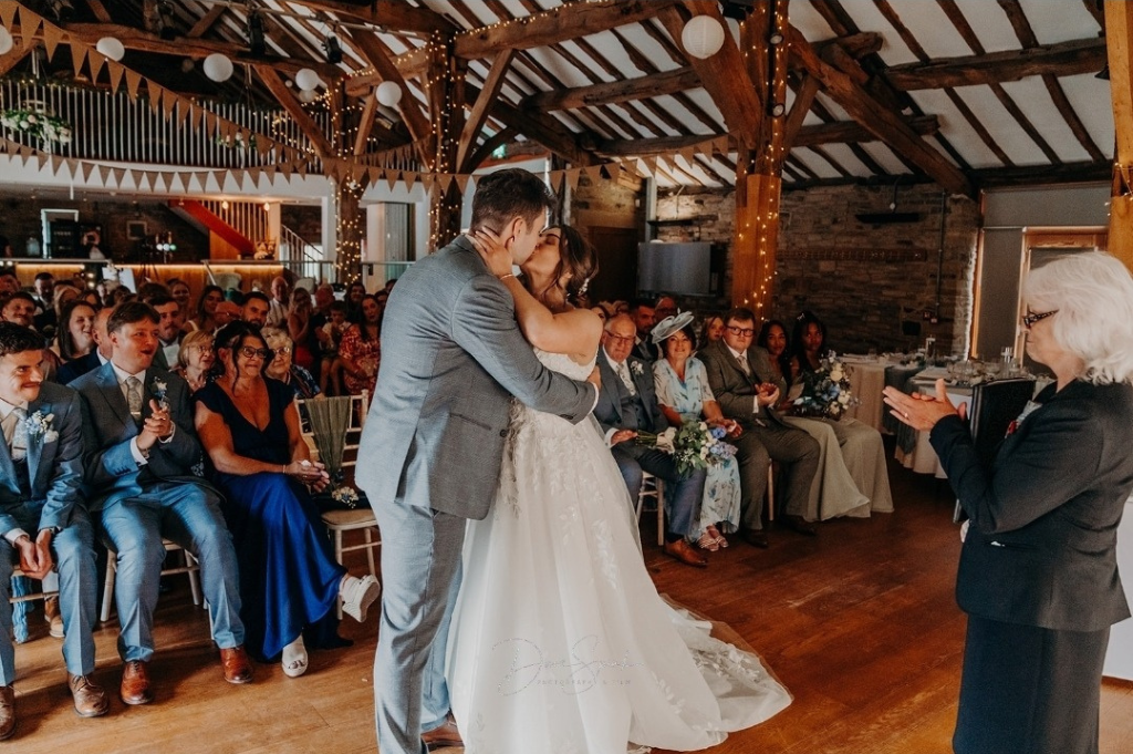 bride and groom kissing on the dancefloor