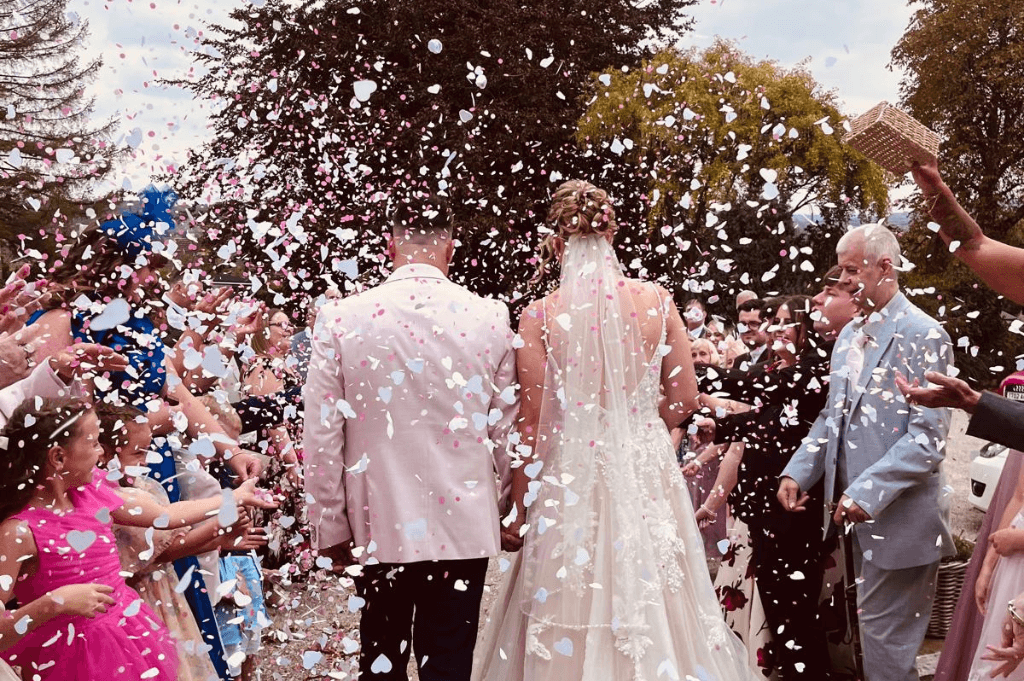 Bride and groom in confetti at The Northorpe Barn